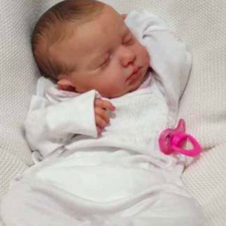 newborn reborn with pacifier